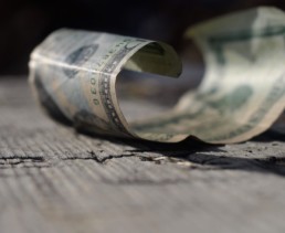 a lost, crumpled $20 bill